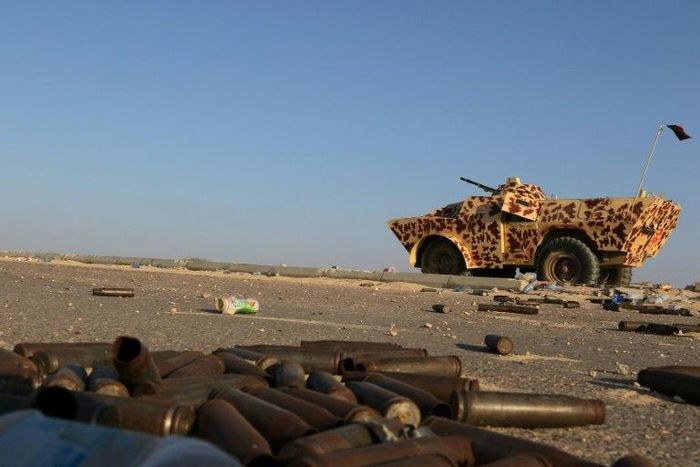 A military vehicle used by fighters from the pro-government forces loyal to Libya's Government of National Unity (GNA) is seen near ammunition casing on August 3, 2016 in Sirte during an operation against jihadists of the Islamic State group 