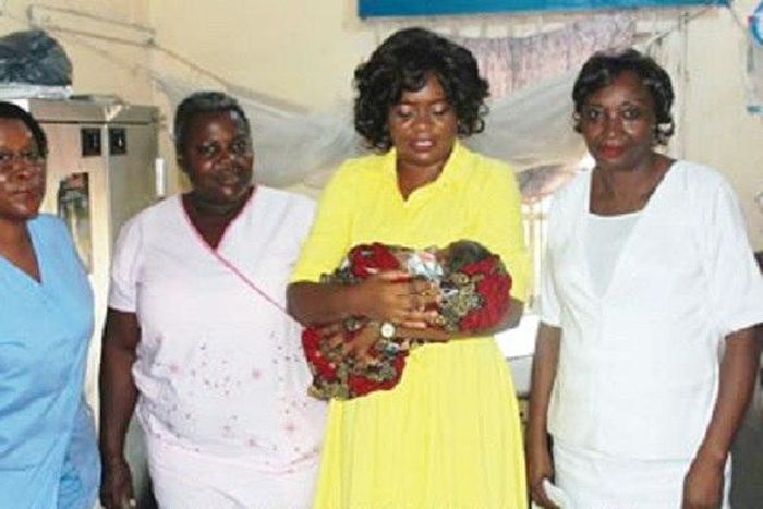 Dr. Inyang Asibong with one of the rescued babies