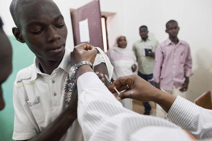 Staff members of Teaching Hospital receive the first vaccination treatment for yellow fever in El Geneina, West Darfur in this November 14, 2012 handout.