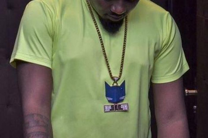 Ice Prince, wearing the logo of his record label, 'Super Cool Cat'