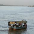 Sudanese villagers travel by boat on the river Nile in Sudan's capital Khartoum, September in a file photo. REUTERS/Antony Njuguna