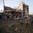 Civilians evacuate from the scene of a suicide car bombing outside Hotel Ambassador on Maka Al Mukaram Road in Somalia's capital Mogadishu, June 1, 2016.