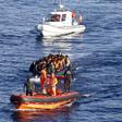 A Turkish Coast Guard fast rigid-hulled inflatable boat tows a dinghy filled with refugees and migrants in the Turkish territorial waters of the North Aegean Sea, following a failed attempt at crossing to the Greek island of Chios, off the shores of Iz...