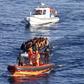 A Turkish Coast Guard fast rigid-hulled inflatable boat tows a dinghy filled with refugees and migrants in the Turkish territorial waters of the North Aegean Sea, following a failed attempt at crossing to the Greek island of Chios, off the shores of Iz...