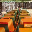 Coffins of Malian army officers killed in an attack are displayed on July 21, 2016 in Segou during a funeral ceremony