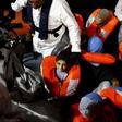 A migrant child smiles as he waits to be transferred from the Migrant Offshore Aid Station (MOAS) ship MV Phoenix to the Norwegian ship Siem Pilot off the coast of Libya August 6, 2015.