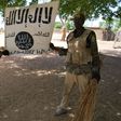 Some soldiers displaying Boko Haram flag after capturing their camps in Sambisa Forest.