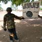 Some soldiers displaying Boko Haram flag after capturing their camps in Sambisa Forest.