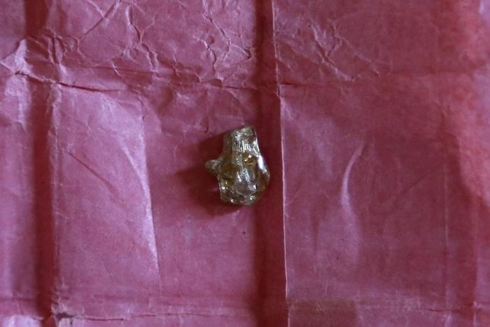 A rough diamond, from the Boda region in Central African Republic, is displayed for sale in Bangui May 1, 2014.