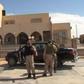 A still image from video released May 17, 2016 shows forces loyal to Libyan unity government outside the National Commercial bank after the recapture of Abu Grain, one of the main checkpoints south of the city of Misrata, Libya from Islamic State.