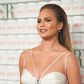Chrissy Teigen shows off baby bump