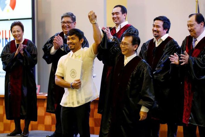 Elections officials declare Philippine boxing star Manny Pacquiao (centre L) as a senator, in Manila, Philippines May 19, 2016.