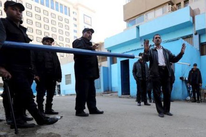 Policemen guard in front of a morgue where the body of an Italian Giulio Regeni is kept in Cairo, Egypt, February 4, 2016.