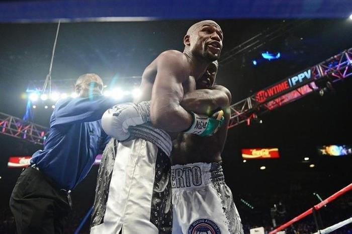 Floyd Mayweather (black trunks) talks with the crowd during his WBA/WBC welterweight title bout against Andre Berto (white trunks) at MGM Grand Garden Arena. Mayweather won via unanimous decision. Sep 12, 2015; Las Vegas, NV, USA;