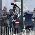 Police at the scene where shots were fired during a police search of a house in the suburb of Forest near Brussels, Belgium, March 15, 2016.   REUTERS/Francois Lenoir