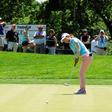 Jul 11, 2015; Lancaster, PA, USA; Jenny Shin putts on the eighth green in front of a leaderboard during the third round of the 2015 U.S. Women's Open at Lancaster Country Club.