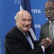 Sepp Blatter shaking hands with Amaju Pinnick