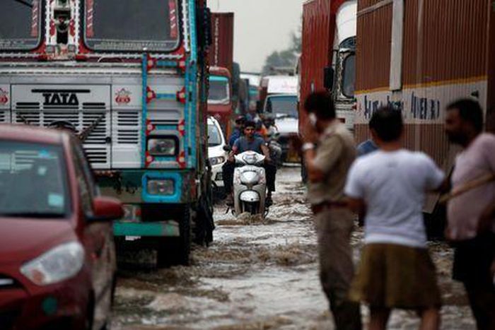 Monsoon deluge in Indian cities causes traffic chaos, sewage swirls