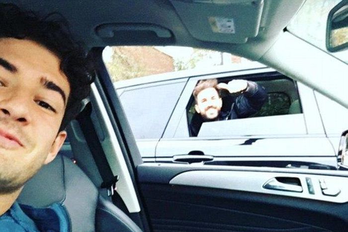 Alexandre Pato takes a selfie from his car with Chelsea teammate Cesc Fabregas
