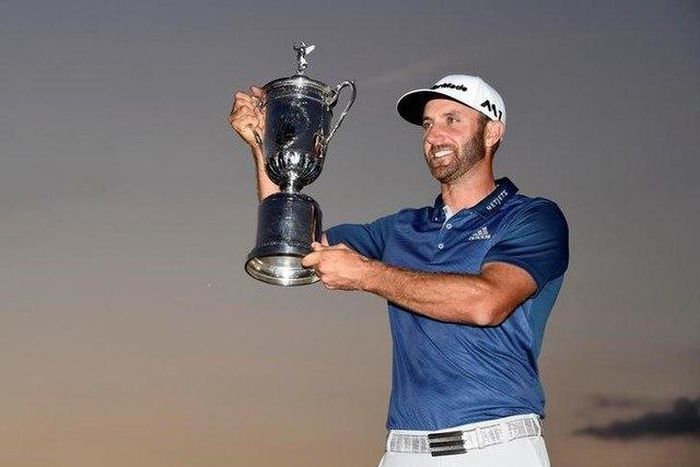 Johnson wins first major title amid rules controversy