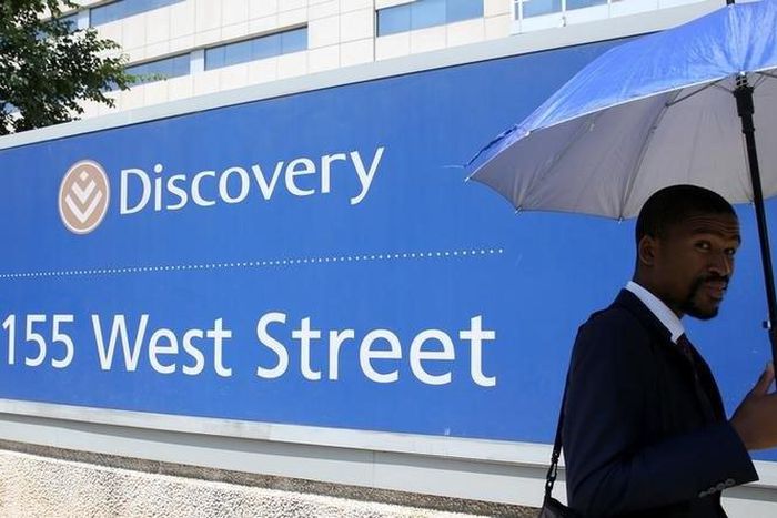 A man walks past the Discovery headquarters in Sandton, February 24, 2016.