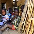 Internally displaced children sit inside their shelter in Kalma camp in Nyala, South Darfur, Sudan, November 22, 2015.