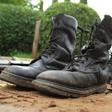 Military boots are displayed after they were recovered from suspected fighters following clashes in the capital Bujumbura, Burundi December 12, 2015. REUTERS/Jean Pierre Aime Harerimana