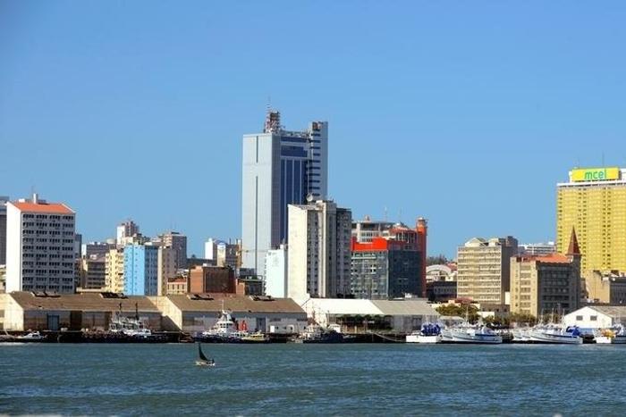 Fishing boats sit beneath the skyline of Mozambique's capital Maputo, April 15, 2016.