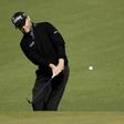 Branden Grace chips onto the 2nd green during the second round of the 2016 The Masters golf tournament at Augusta National Golf Club.
