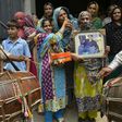 Relatives of Pakistani national Zulfiqar Ali, who was sentenced to death in 2005 for heroin possession, celebrate in Lahore after the Indonesian government halted his execution
