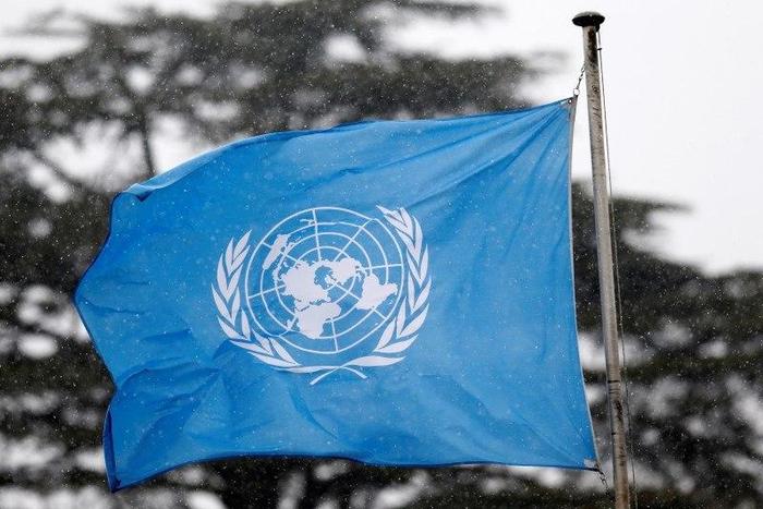 A United Nations flag flies outside the the European headquarters of the United Nations ahead of new round of meetings for the Syria talks in Geneva, Switzerland, March 16, 2016.
