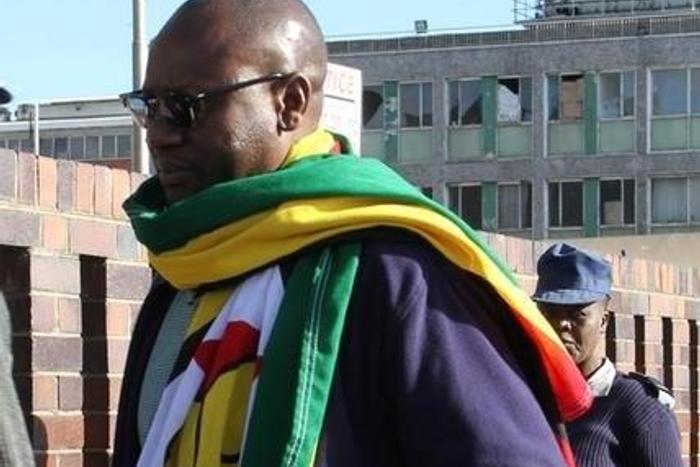 Zimbabwean Pastor Evan Mawarire , who organized a 'stay at home' anti-government protest last week, arrives at the Harare Central Police station in Zimbabwe, July 12, 2016.