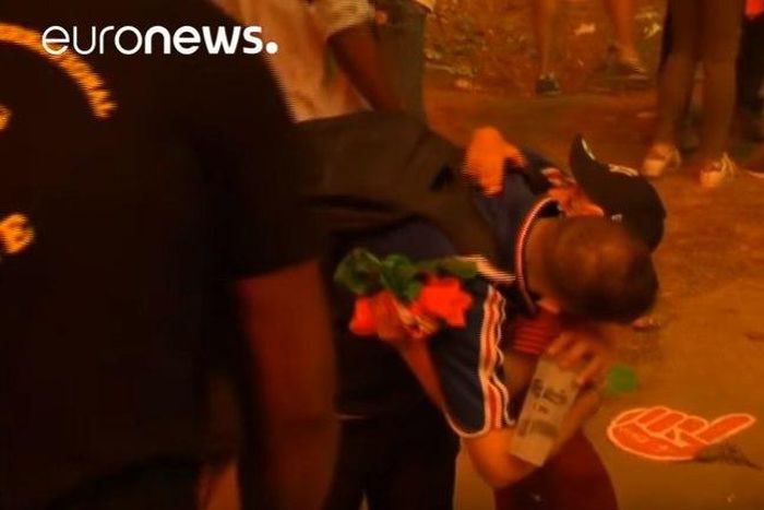 Young Portugal fan consoles heartbroken Frenchman