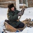 Prokopy Nogovitsyn shows part of a mammoth skeleton in the backyard of his house in a village in the northern Siberian region of Yakutia