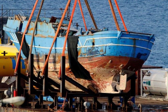 The wreck of a fishing boat that sank in April 2015, drowning hundreds of migrants packed on board, is seen after being raised in the Sicilian harbour of Augusta, Italy, July 1, 2016.