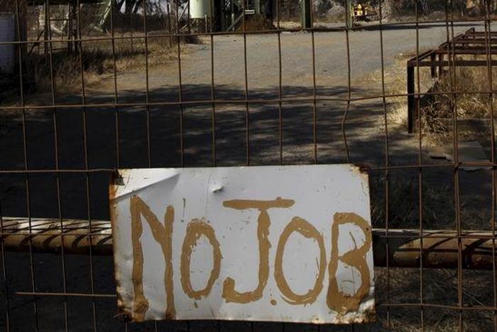 A "no job" sign is placed at the entrance of the Aurora gold mine outside Johannesburg, South Africa. August 13 2010.