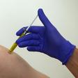 A volunteer receives a trial Ebola vaccine at the Centre for Clinical Vaccinology and Tropical Medicine in Oxford, southern England January 16, 2015.