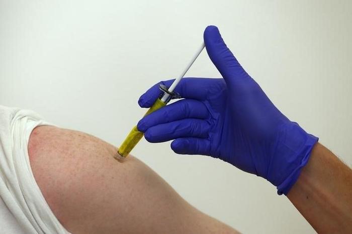 A volunteer receives a trial Ebola vaccine at the Centre for Clinical Vaccinology and Tropical Medicine in Oxford, southern England January 16, 2015.