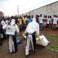 Healthcare workers prepare to remove the body of a man suspected of carrying Ebola in Monrovia, Liberia, July 17, 2015. REUTERS/James Giahyue