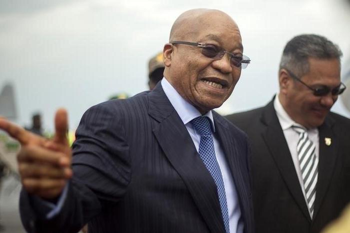 South African counterpart Jacob Zuma gestures as he departs at the airport after an Africa Union-sponsored dialogue in an attempt to end months of violence in Burundi's capital Bujumbura, February 27, 2016. REUTERS/Evrard Ngendakumana