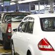 A worker inspects cars at Nissan's manufacturing plant in Rosslyn, outside Pretoria, file photo.
