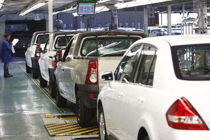 A worker inspects cars at Nissan's manufacturing plant in Rosslyn, outside Pretoria, file photo.