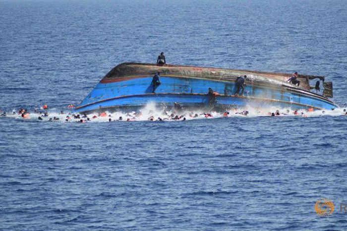 Italy navy says migrant boat flipped, five dead