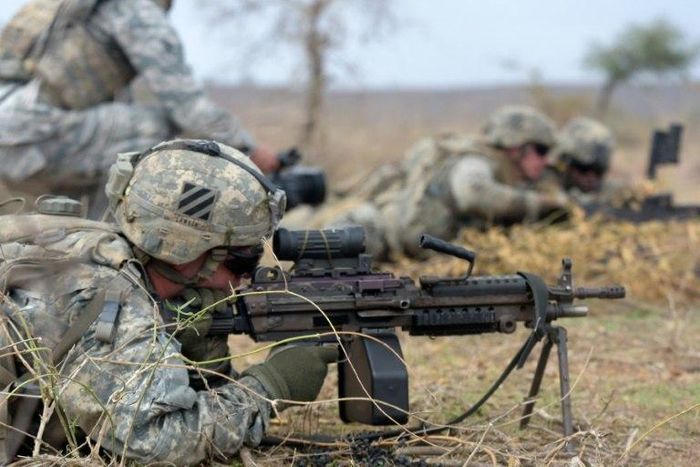 American soldiers of 1st Battalion, 30th Infantry Regiment, 2nd Infantry Brigade Combat Team, 3rd Infantry Division deploy during a combined training exercise with Senegalese 1st Paratrooper Battalion in Thies on July 25, 2016 