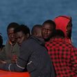Migrants, who are part of a group intercepted aboard a makeshift boat off the coast in the Mediterranean sea, stand on a rescue boat upon arriving at a port in Malaga, southern Spain, May 19, 2016.