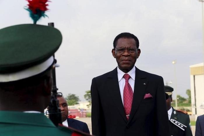Equatorial Guinea's President Teodoro Obiang Nguema Mbasogo inspects a guard of honour upon his arrival at the presidential airport in Abuja, Nigeria May 28, 2015.