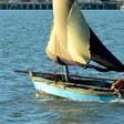 A fisherman bails out his boat in Maputo, Mozambique, May 18, 2016.
