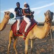 Timi Dakolo and wife Busola Dakolo atop a Camel