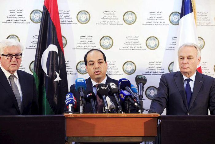 A member of the Presidential Council of Government of National Accord, Ahmed Maiteeq (C) stands next to German Foreign Minister Frank-Walter Steinmeier (L) and French Foreign Minister Jean-Marc Ayrault (R) dueing a joint news conference in Tripoli, Lib...