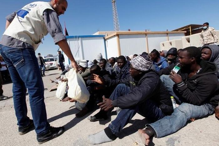 Migrants receive emergency relief in a port, after being rescued at sea by Libyan coast guard, in Tripoli, Libya April 11, 2016.
